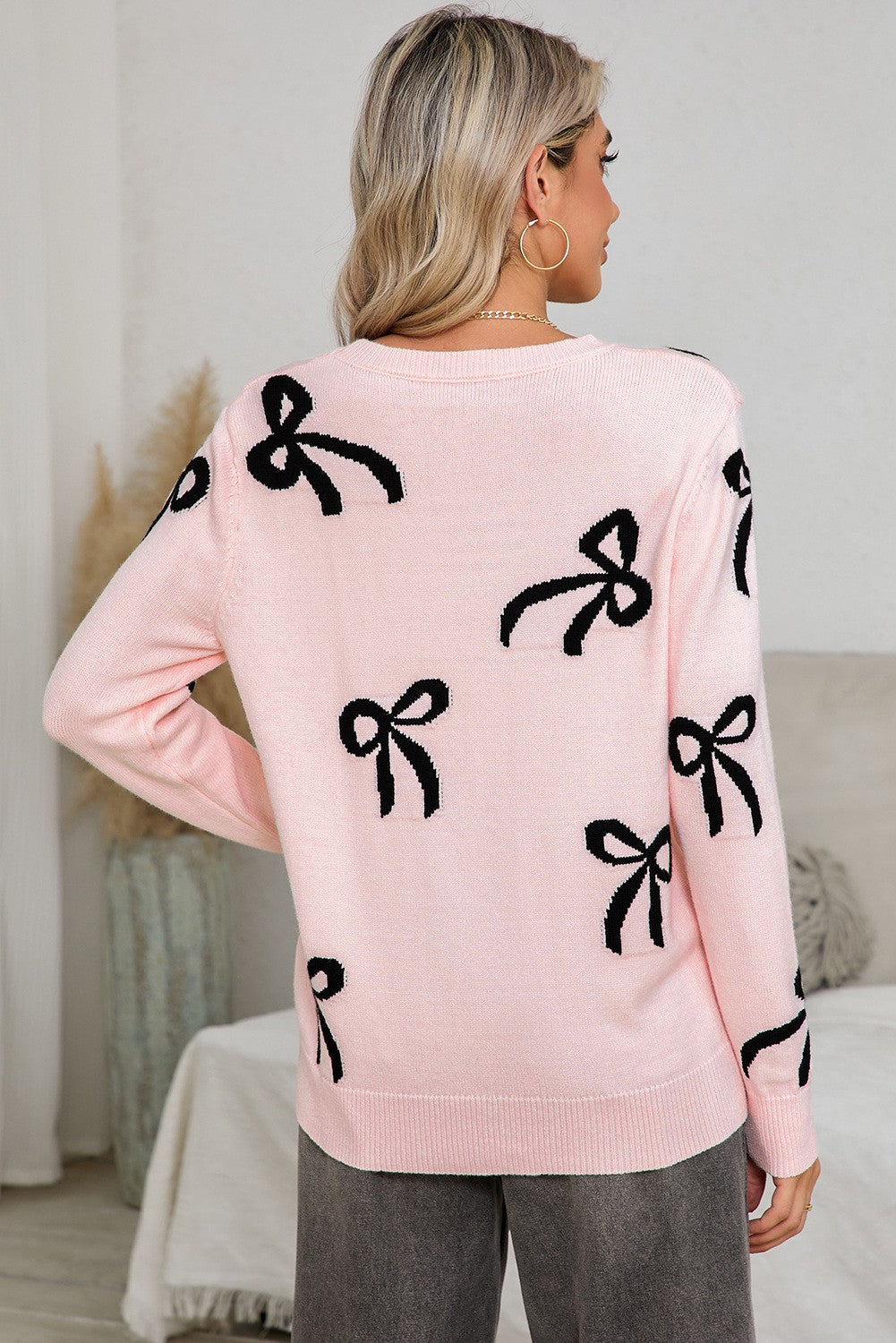 Pink Sweater with Black Bow Print